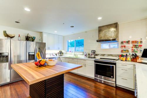 a large kitchen with a wooden table in it at INNhale Resort and Spa in Manitou Springs