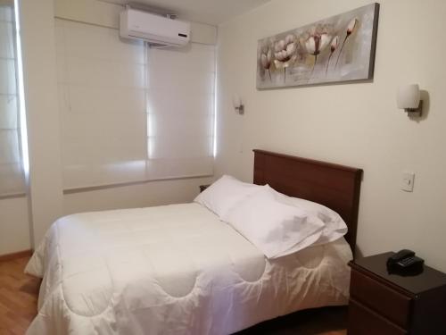 Кровать или кровати в номере Belle Sand Hotel