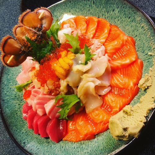a green plate of food with salmon and other vegetables at The Inn at Kulaniapia Falls in Hilo