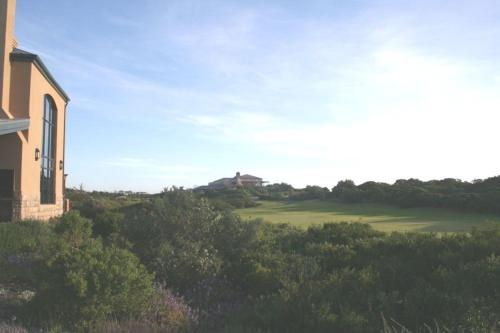 a view of a house and a golf course at The Lodge at Atlantic Beach in Melkbosstrand