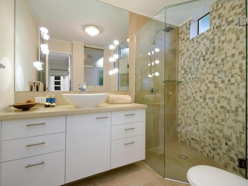 a bathroom with a sink and a shower at Mariner Cove 1 in Mooloolaba