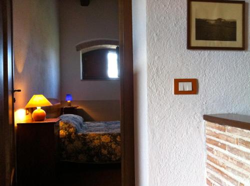 Posteľ alebo postele v izbe v ubytovaní Residenza d'Epoca La Commenda