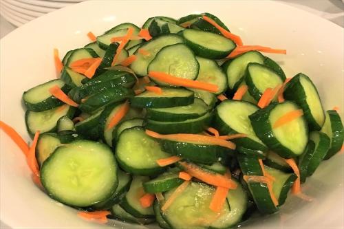 a plate of vegetables with carrots and cucumbers at Green Rich Hotel Hamada Ekimae (Artificial hot spring Futamata Yunohana) in Hamada