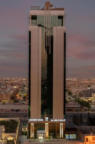 a large building with two towers in a city at Crown Rose Al Sahafa Hotel in Riyadh