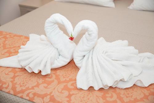 Posteľ alebo postele v izbe v ubytovaní Haraki Bay Hotel and Luxury Apartments