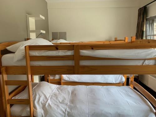 a couple of bunk beds in a room at In den Jager in Poperinge