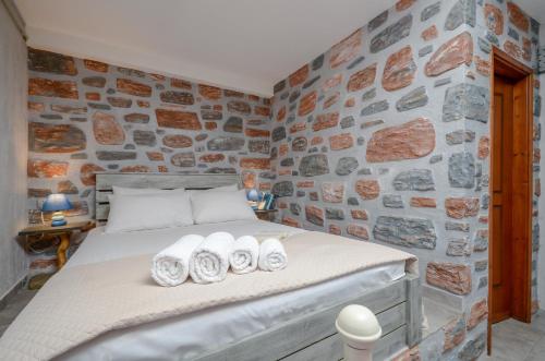 Ένα ή περισσότερα κρεβάτια σε δωμάτιο στο Theonis Villas