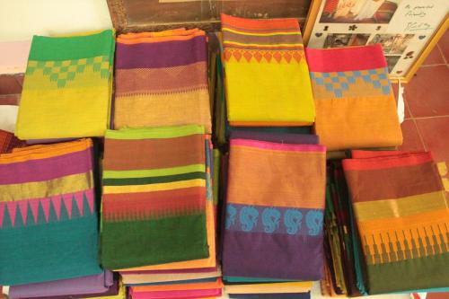 a pile of colorful socks sitting next to each other at Chettinadu Court- HERITAGE VIEW in Kānādukāttān