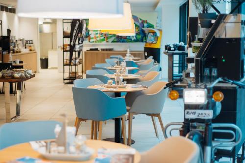 En restaurant eller et andet spisested på myNext - Hotel Leo