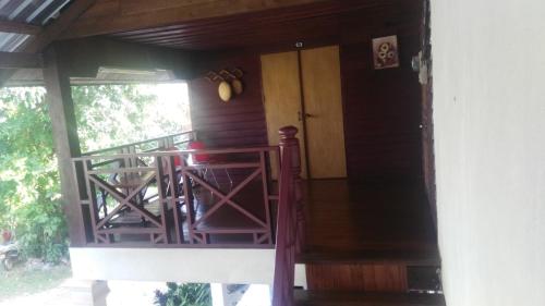 a front porch of a house with a door at Song Lao Guesthouse in Thakhek