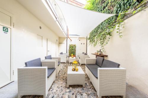 a row of chairs and tables in a building at trifulhouse holiday apartments in Alba
