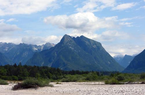 a view of a mountain range with a river at Apartment Pri Leju in Srpenica