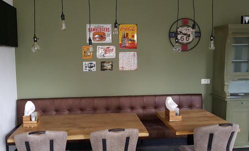 a dining room with a table and two chairs at B&B La Vita Verde in Susteren