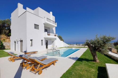 an image of a villa with a swimming pool at Apartment Tilio - New apartment with private pool 1400m from the beach in Rethymno