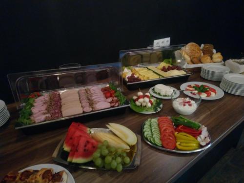 a buffet with different types of food on a table at Willowa Chata in Dzianisz