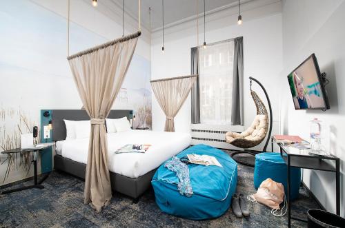 a bedroom with a bed and a chair at Three Corners Hotel Anna in Budapest