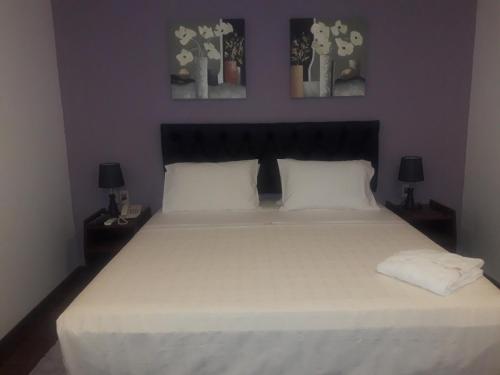 Hotel Casa Jardinにあるベッド