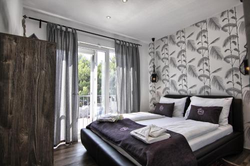Ένα ή περισσότερα κρεβάτια σε δωμάτιο στο HD Beach House I