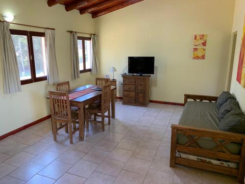 a living room with a table and a couch at Terrazas de Colón in Colón
