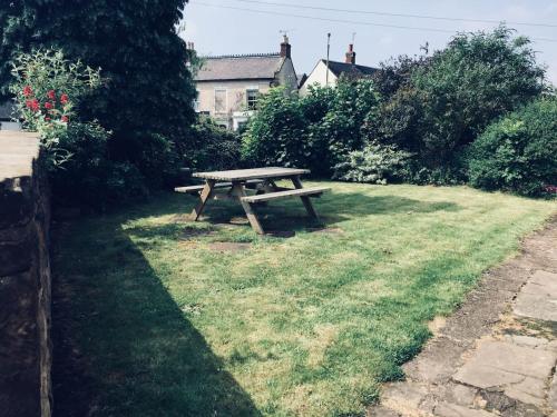 a picnic table sitting in the grass in a yard at 75 High Street in Melbourne