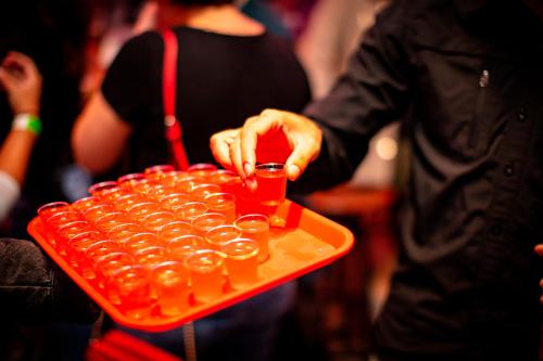a person holding a tray of small medicines at Kick Ass Greyfriars (18+) in Edinburgh