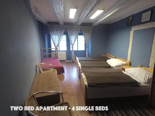 Кровать или кровати в номере DN Pub Apartments