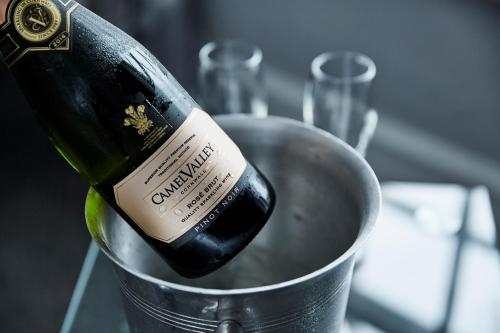 a bottle of wine sitting in a bucket at The Falcon Hotel in Bude