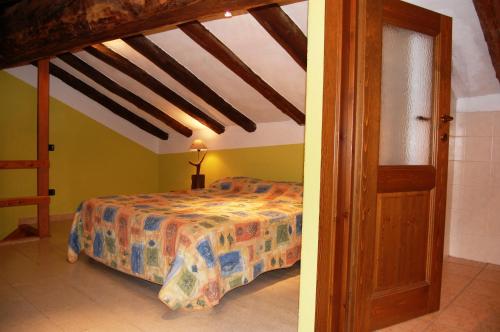Postel nebo postele na pokoji v ubytování Case Gran Paradiso Villaggio Melignon