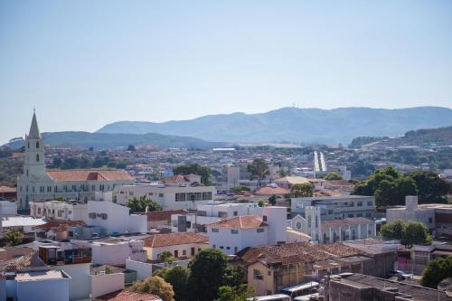 a view of a city with a church and buildings at STALO HOTEL in Piumhi