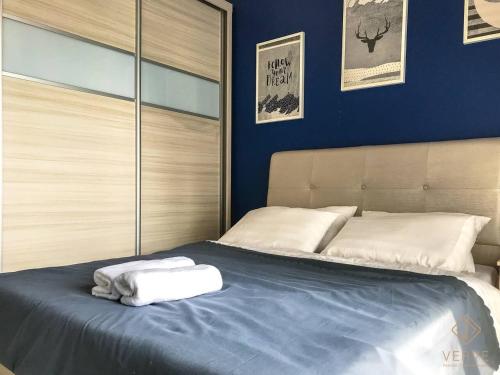 a bedroom with a bed with two towels on it at Ipoh Majestic Premium Suites by Verve in Ipoh
