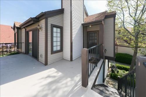 a small house with a porch and a balcony at Village Bay 1 - V006 in Lake Arrowhead