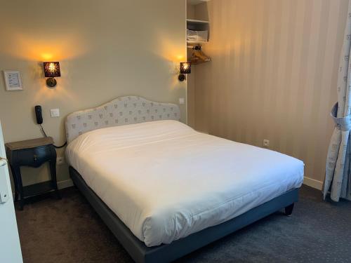 Ένα ή περισσότερα κρεβάτια σε δωμάτιο στο L'Auberge du Port des Roches