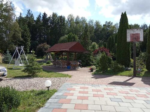 a garden with a gazebo and a playground at Chata Baby Jagi in Krzywe