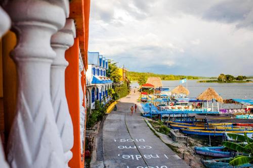 a view from a balcony of a harbor with boats at Hotel San Miguel in Flores