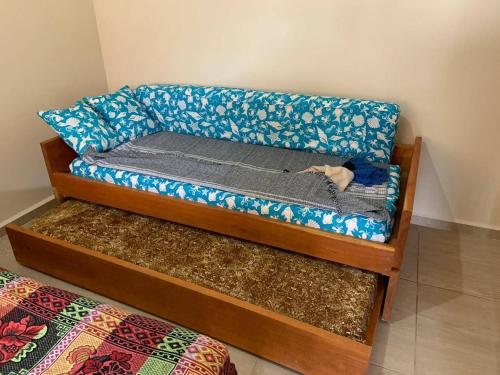 a couch with a dog laying on top of it at Pousada Ilha Sul in Cananéia