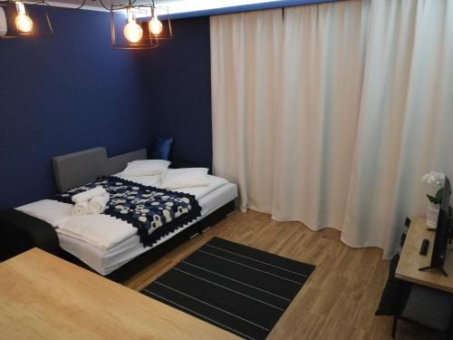 Ένα ή περισσότερα κρεβάτια σε δωμάτιο στο Bulevard Apartments