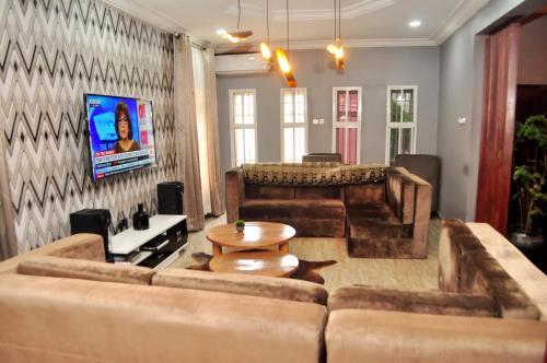 a living room with a couch and a table at J Gibson Hotel in Lagos