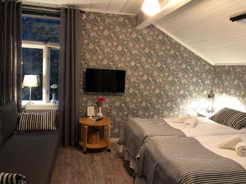 Säng eller sängar i ett rum på Villa Frideborg