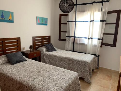 Postel nebo postele na pokoji v ubytování CasadeLanzarote