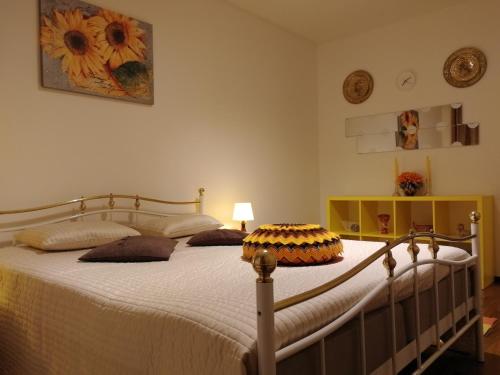 a bedroom with a large bed with pillows on it at Sun Apart Vuorenrinne in Kotka