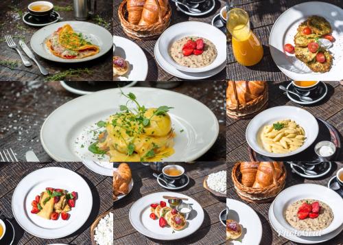 un montón de platos de comida en una mesa en Mini-Hotel Kyivskyі en Kiev