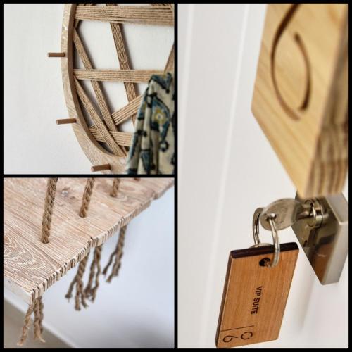 a pair of keys hanging from a wooden rack at Angelos Design Suites in Patitiri