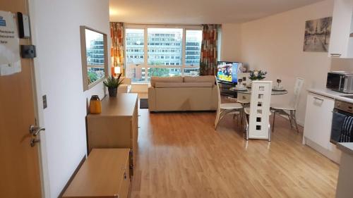 a living room with a kitchen and a dining room at Marco Island -Very Spacious City Centre 1 Bedroom Apartment in Nottingham