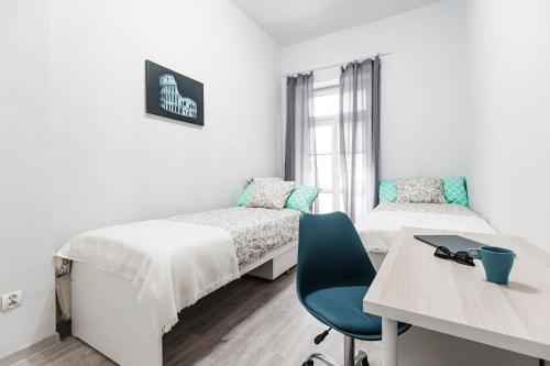 Posteľ alebo postele v izbe v ubytovaní Apartament Niebieski Krakowskie Przedmieście 26