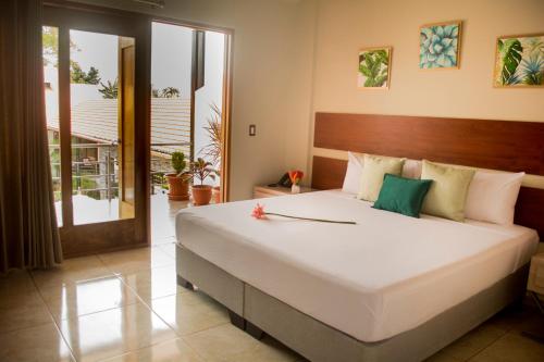 Postel nebo postele na pokoji v ubytování Colina de Montalva Casa Hotel