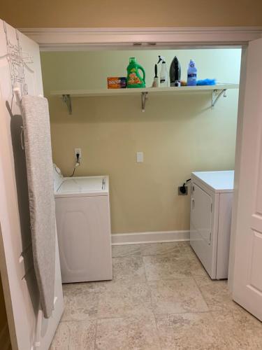 a laundry room with a washer and dryer at Elegant Jewel in Lithonia