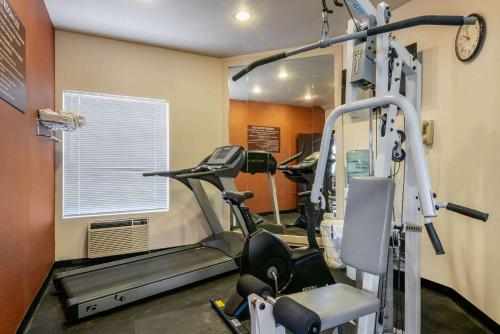 a gym with several tread machines in a room at Comfort Inn Columbia Gorge in The Dalles