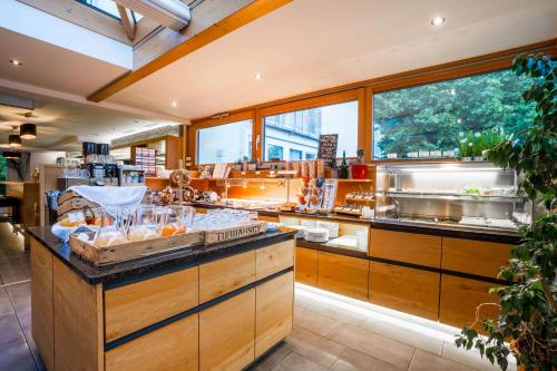 a kitchen with a counter with food on it at MEAT UND STAY Hotel in Haar