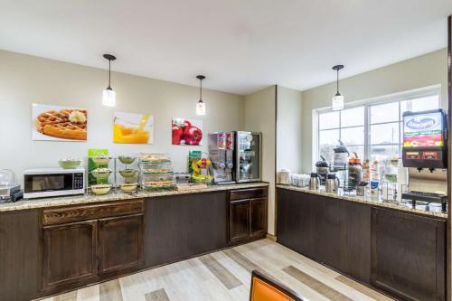 a fast food restaurant with a counter with food at Quality Inn & Suites North Lima - Boardman in North Lima