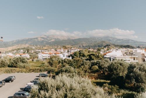 a city with cars parked in a parking lot at Best House, Nirvana II, Patra in Patra
